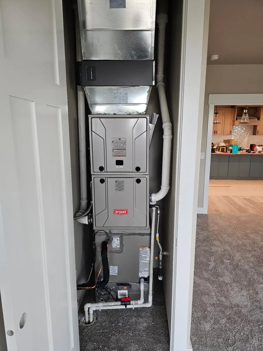 Vertical furnace installation in an interior closet