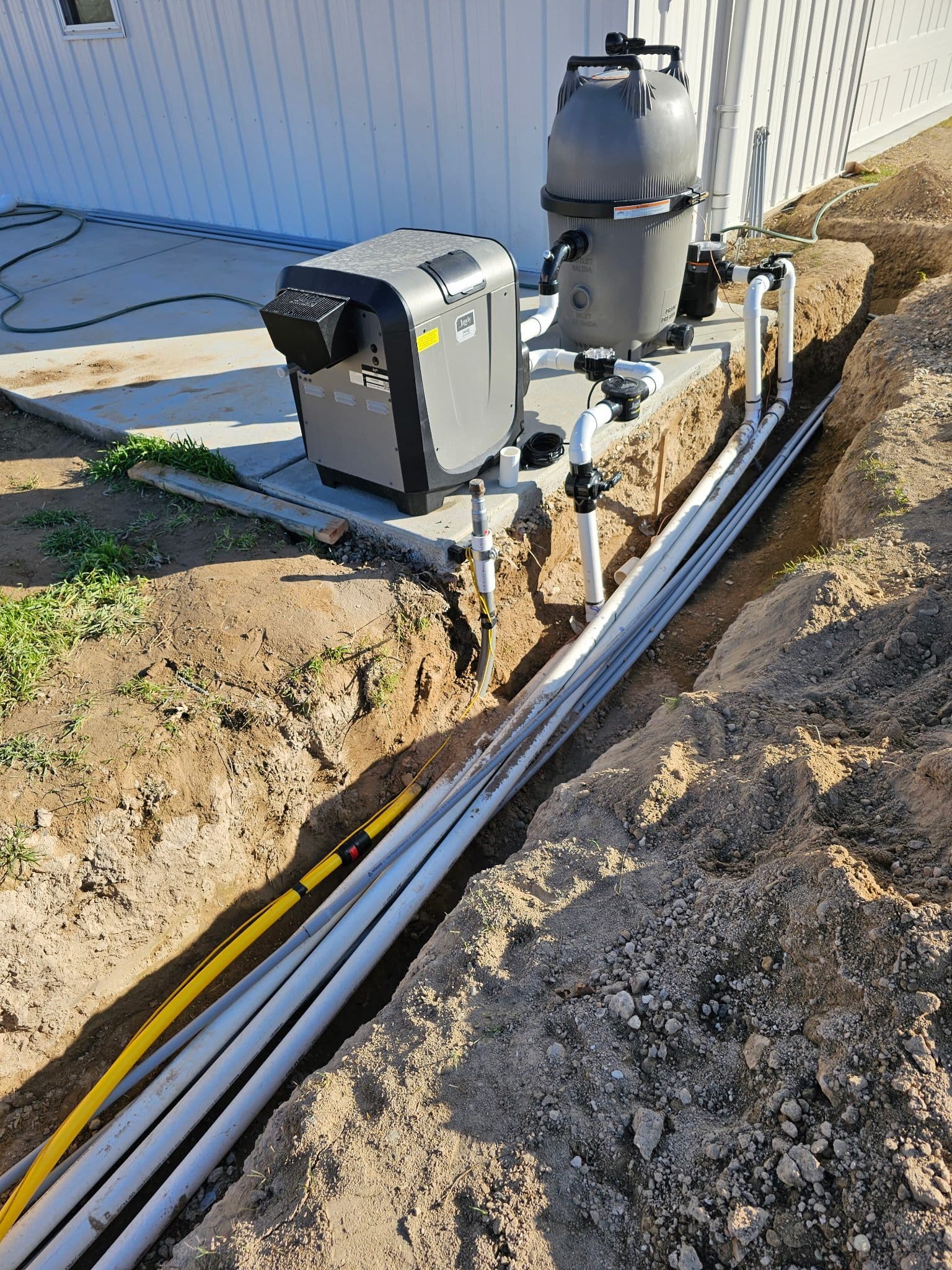 Underground gas line trench serving pool equipment