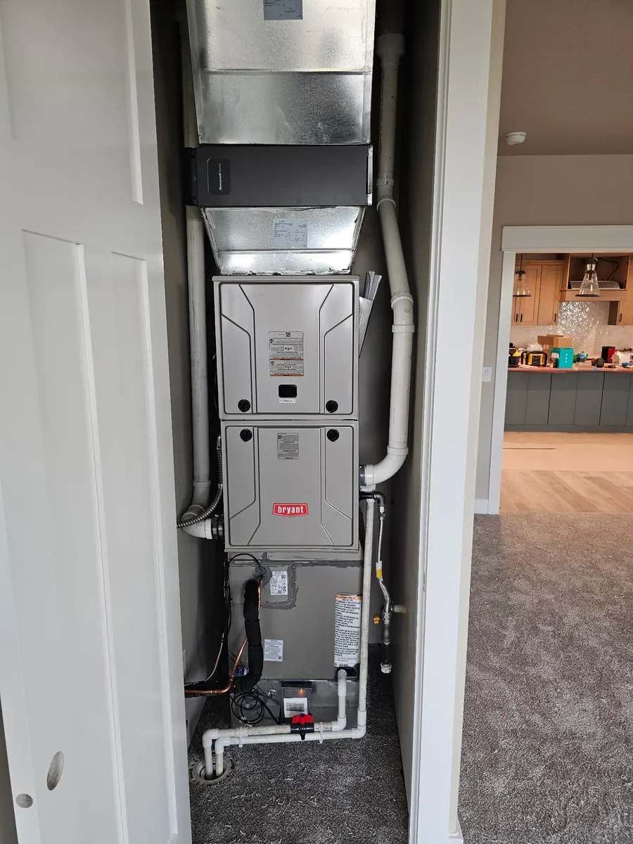 Vertical furnace installation in an interior closet
