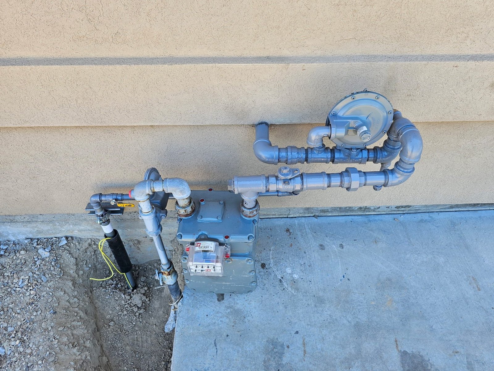 Gas meter piping correction with regulator and shutoff