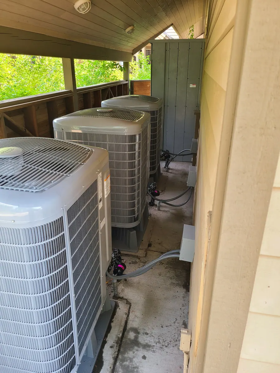 Outdoor air conditioning condensers in a service area