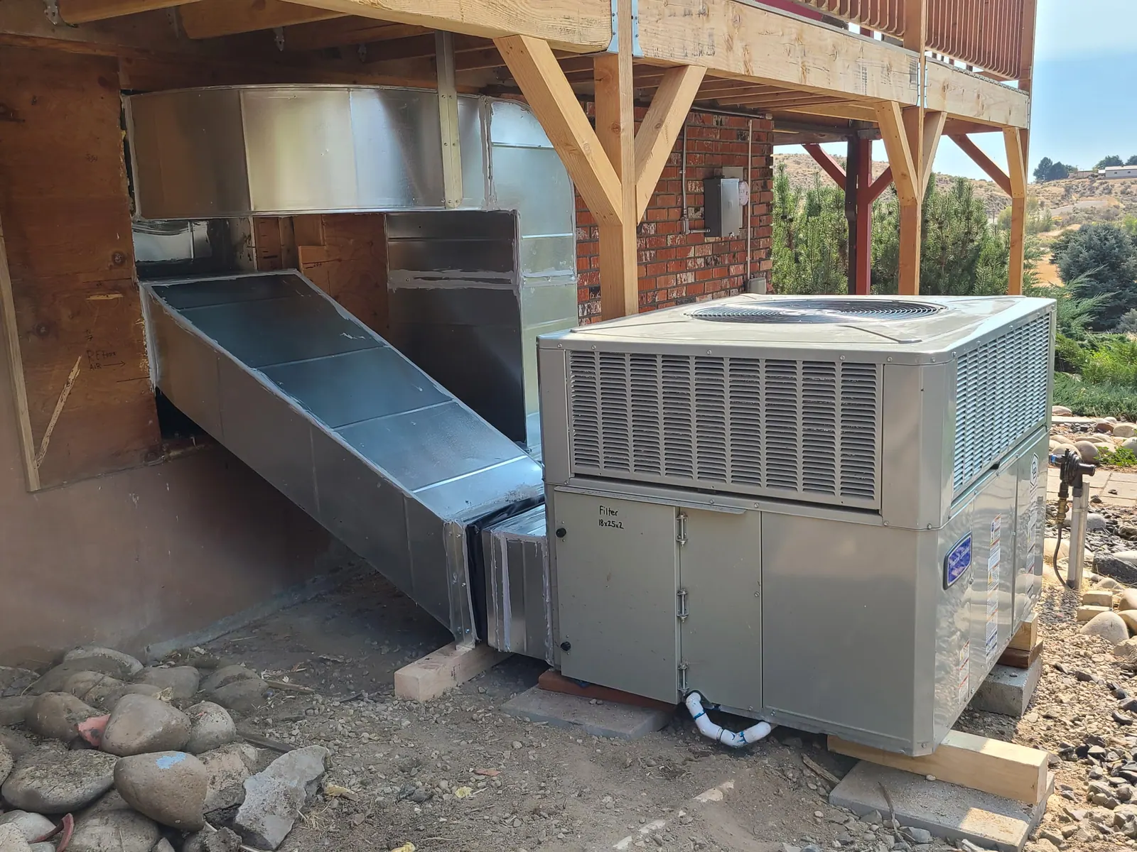 Outdoor HVAC equipment installed beside a home