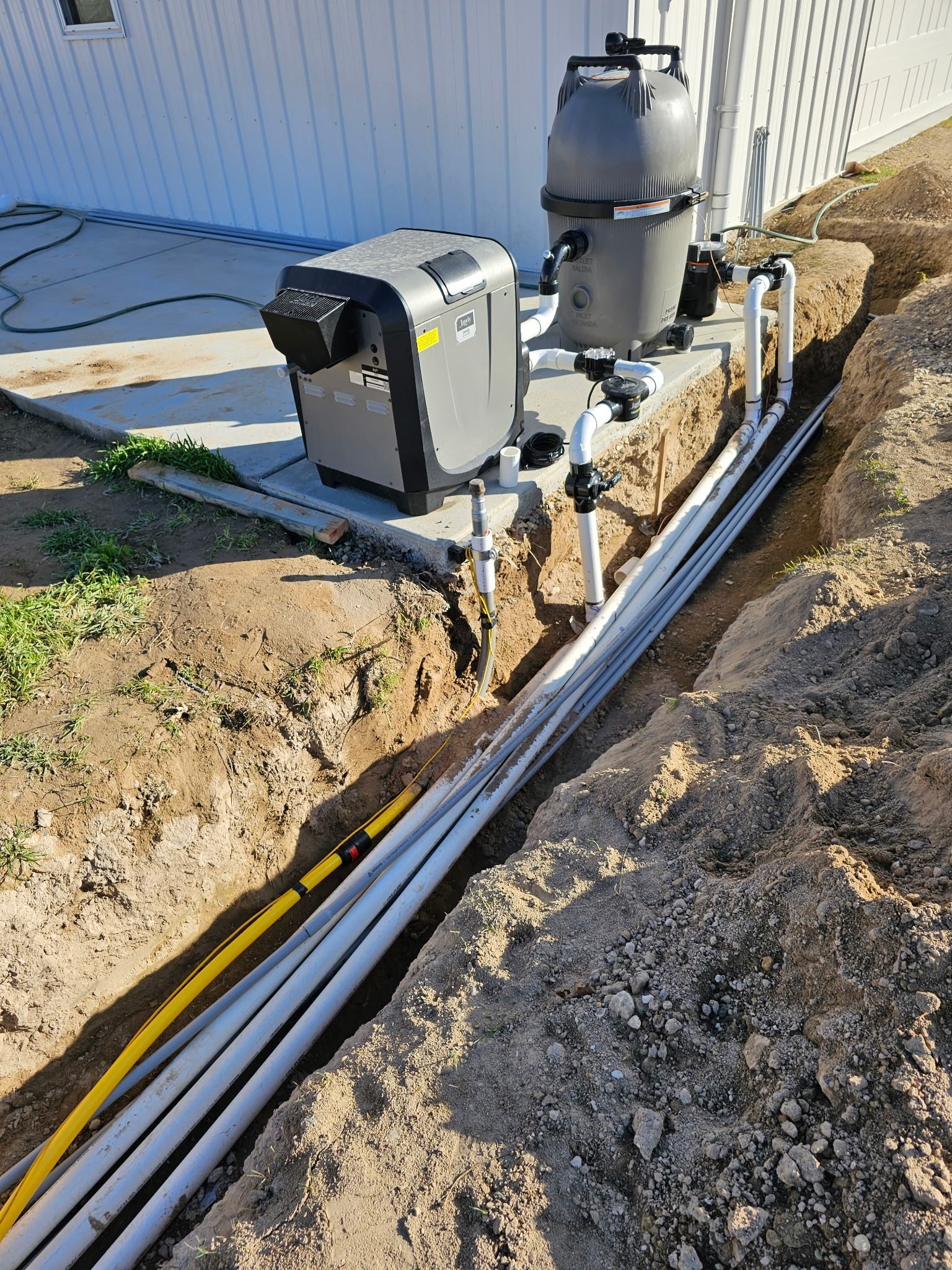 Underground gas line trench serving pool equipment